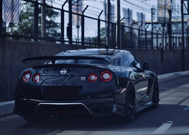 Black Nissan GT-R R35 with rear wing on Melbourne street ready for roadworthy certificate inspection at Garage Full Throttle Craigieburn